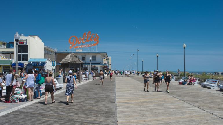 Rehoboth's beach and boardwalk bustling in the summer Rehoboth's beach and boardwalk bustling in the summer