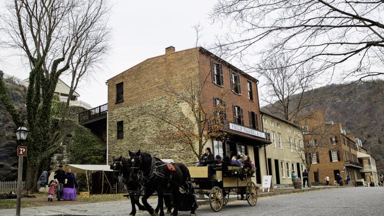 Taking a horse-drawn carriage ride through historic Harpers Ferry Taking a horse-drawn carriage ride through historic Harpers Ferry