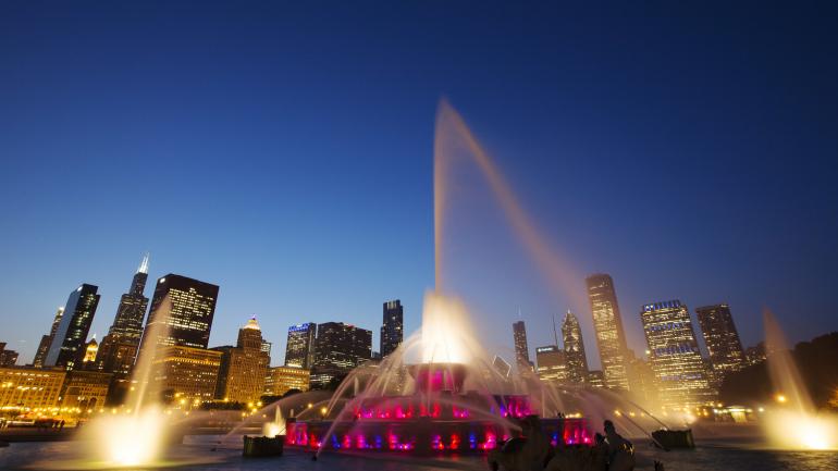 An illuminated scene of Buckingham Fountain in the center of Grant Park An illuminated scene of Buckingham Fountain in the center of Grant Park