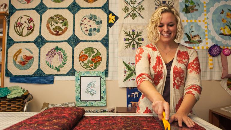 A fabric artist begins work on a quilting project at the National Quilt Museum A fabric artist begins work on a quilting project at the National Quilt Museum