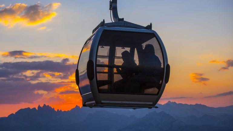 A summer gondola ride during a golden sunset A summer gondola ride during a golden sunset