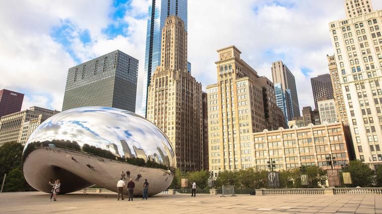 The shiny Cloud Gate sculpture, known as The Bean, in Millennium Park in Chicago, Illinois The shiny Cloud Gate sculpture, known as The Bean, in Millennium Park in Chicago, Illinois