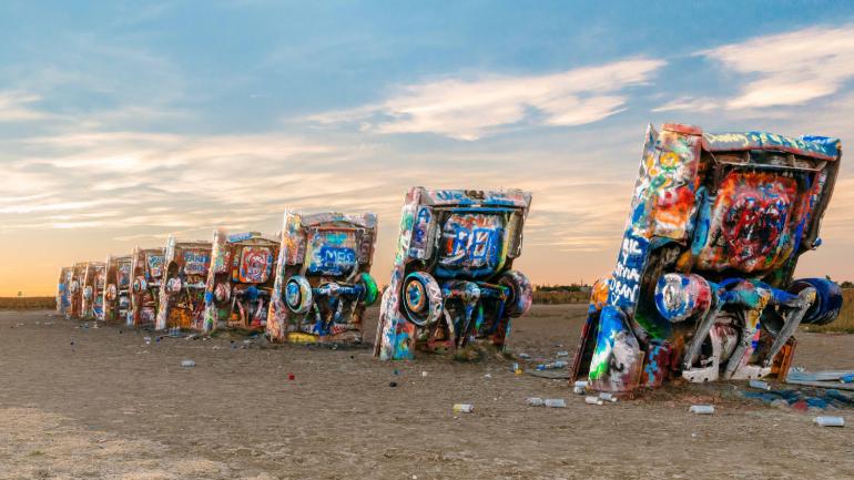 Colorfully painted Cadillacs plunged into the ground at Cadillac Ranch in Amarillo, Texas Colorfully painted Cadillacs plunged into the ground at Cadillac Ranch in Amarillo, Texas