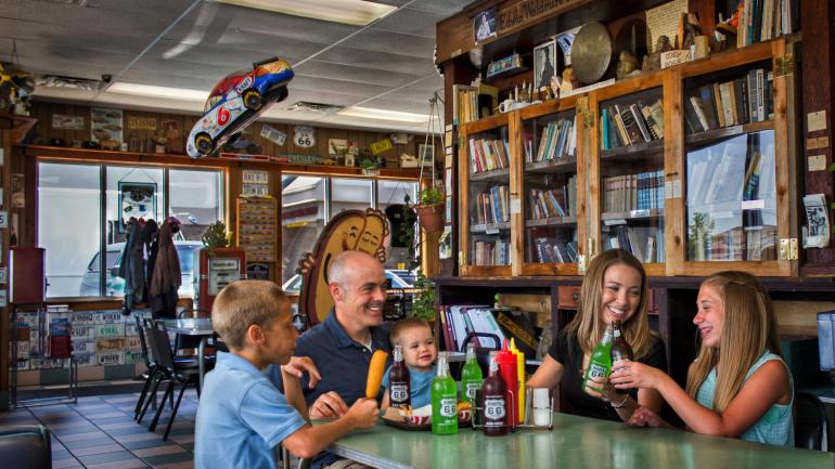 Eating cozy dogs and drinking Route 66 soda at Cozy Dog Drive In Eating cozy dogs and drinking Route 66 soda at Cozy Dog Drive In