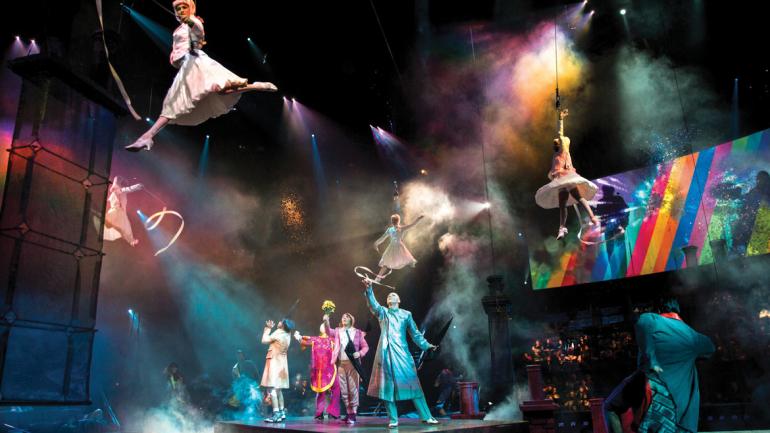 An explosion of energy, light and color bursts onto the stage powered by The Beatles' rock anthem, "Get Back." An explosion of energy, light and color bursts onto the stage powered by The Beatles' rock anthem, "Get Back."