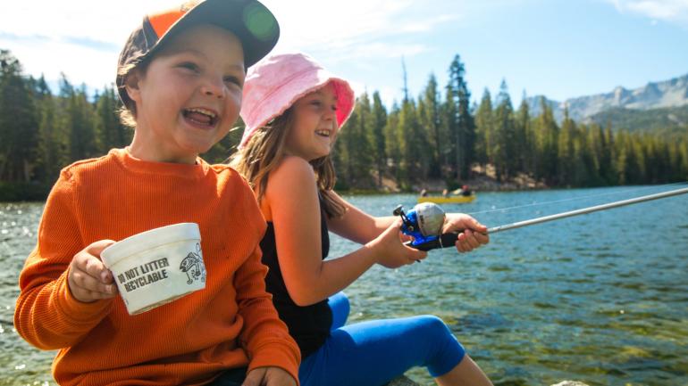 Kids fish from a cozy, rocky spot on beautiful Mammoth Lake Kids fish from a cozy, rocky spot on beautiful Mammoth Lake