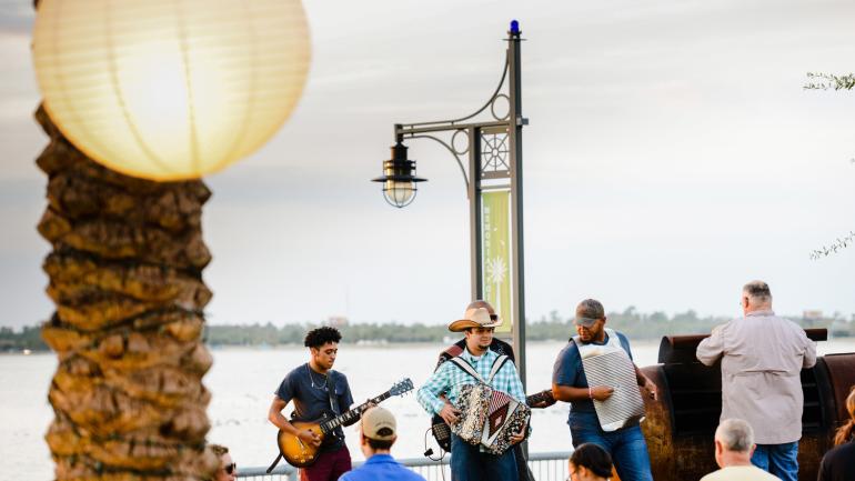 A lakeside musical performance A lakeside musical performance