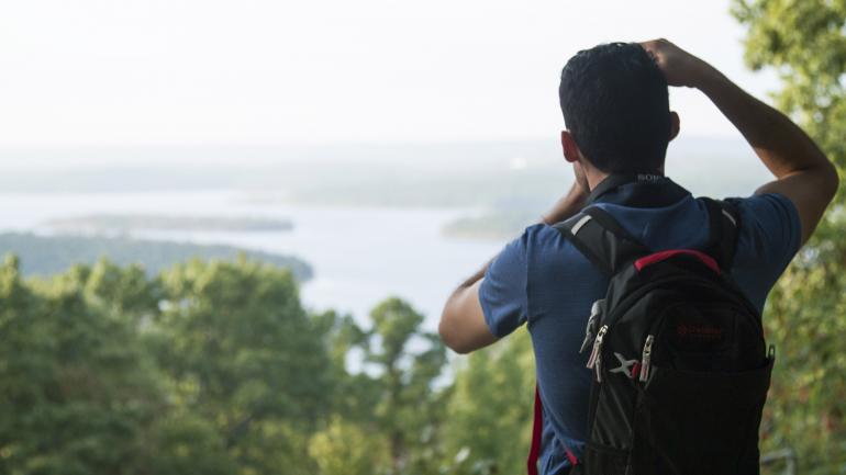 Capturing the incredible view after climbing to the top of Pinnacle Mountain Capturing the incredible view after climbing to the top of Pinnacle Mountain