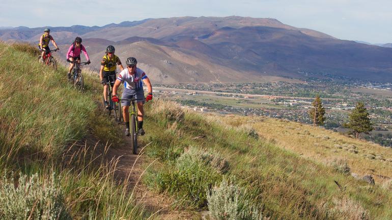 Mountain bikers trek down the trails in Ash Canyon Mountain bikers trek down the trails in Ash Canyon