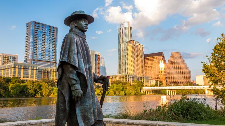 Statue of famed Bluesman Stevie Ray Vaughan at Lady Bird Lake in Austin Statue of famed Bluesman Stevie Ray Vaughan at Lady Bird Lake in Austin