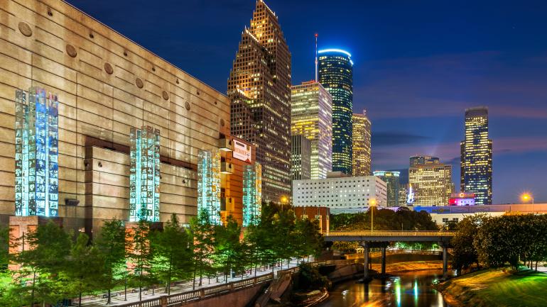 A view of Buffalo Bayou and the nighttime skyline of Houston A view of Buffalo Bayou and the nighttime skyline of Houston