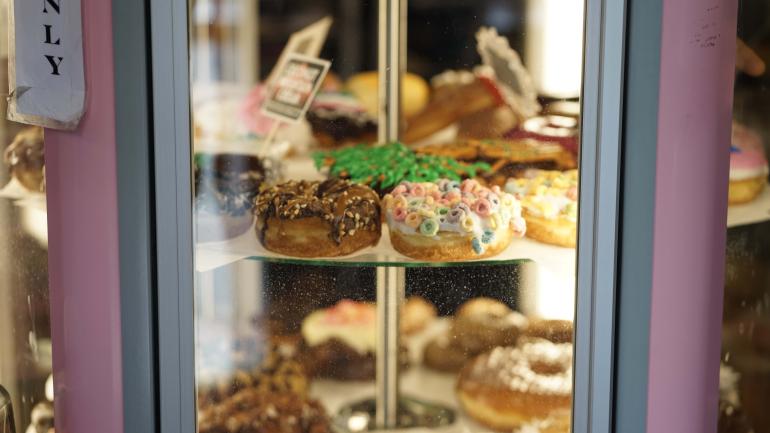 The famous rotating display of colorful Voodoo Doughnut pastries The famous rotating display of colorful Voodoo Doughnut pastries