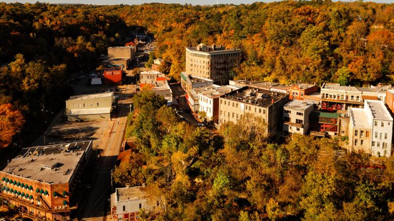 A bird’s-eye view of Eureka Springs surrounded by forests A bird’s-eye view of Eureka Springs surrounded by forests