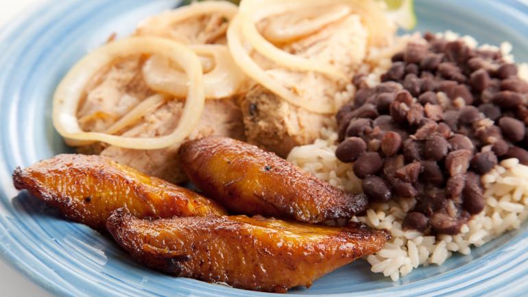 Plate of Cuban soul food including pork, beans, rice and plantains Plate of Cuban soul food including pork, beans, rice and plantains