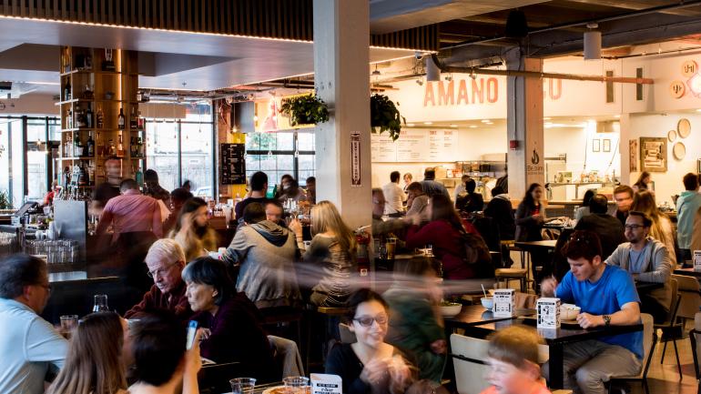 Vibrant food hall scene at R. House Vibrant food hall scene at R. House