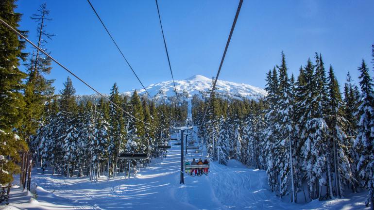 Snowy alpines line the ski lift in Mt. Bachelor ski area Snowy alpines line the ski lift in Mt. Bachelor ski area