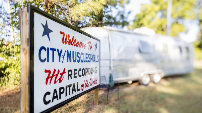A welcome sign for Muscle Shoals, Alabama A welcome sign for Muscle Shoals, Alabama