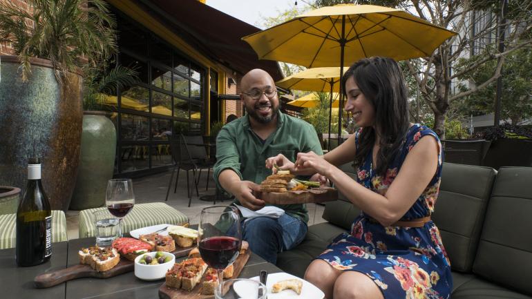 Appetizers and wine during a carefree lunch at Postino Annex in downtown Tempe, Arizona Appetizers and wine during a carefree lunch at Postino Annex in downtown Tempe, Arizona