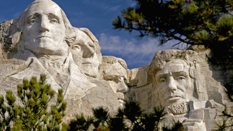 The faces of four former U.S. presidents carved into Mount Rushmore The faces of four former U.S. presidents carved into Mount Rushmore