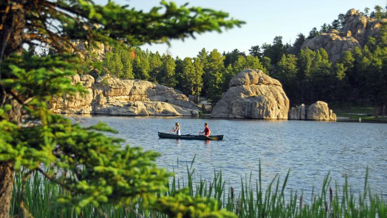 Canoeing in Sylvan Lake, considered the crown jewel of Custer State Park Canoeing in Sylvan Lake, considered the crown jewel of Custer State Park