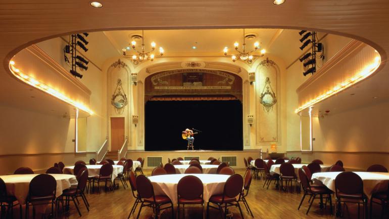 A performer practicing in the historic Eureka Opera House A performer practicing in the historic Eureka Opera House