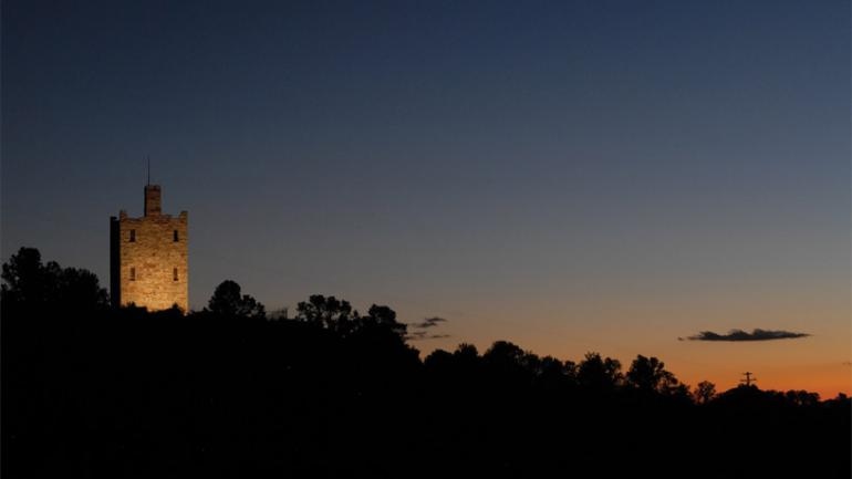 The impressive Stokes Castle looming over the horizon at twilight The impressive Stokes Castle looming over the horizon at twilight
