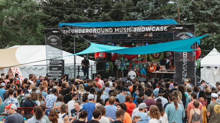 The buzz of the crowd waiting for one of the performers to come on stage at Denver’s Underground Music Showcase The buzz of the crowd waiting for one of the performers to come on stage at Denver’s Underground Music Showcase