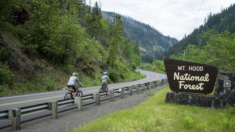 Cycling winding roads through Mt. Hood National Forest on Oregon’s Cascading Rivers Scenic Bikeway Cycling winding roads through Mt. Hood National Forest on Oregon’s Cascading Rivers Scenic Bikeway