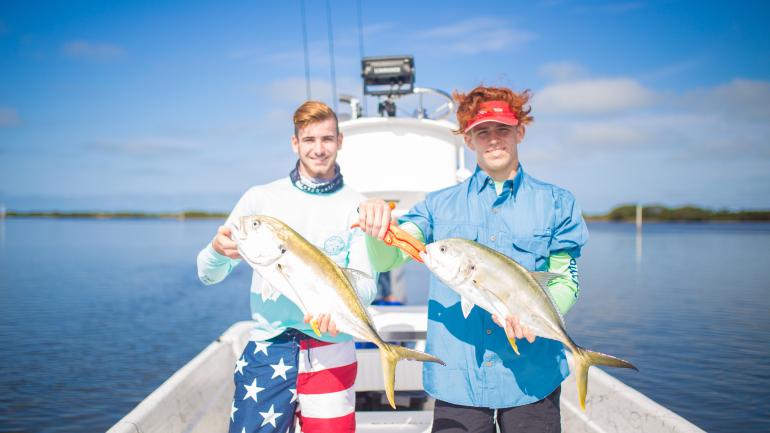 Showing off a pair of crevalle jack caught on Florida’s Adventure Coast Showing off a pair of crevalle jack caught on Florida’s Adventure Coast