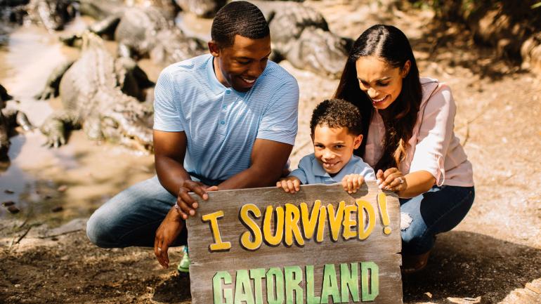 All smiles while posing with the alligators at Gatorland All smiles while posing with the alligators at Gatorland