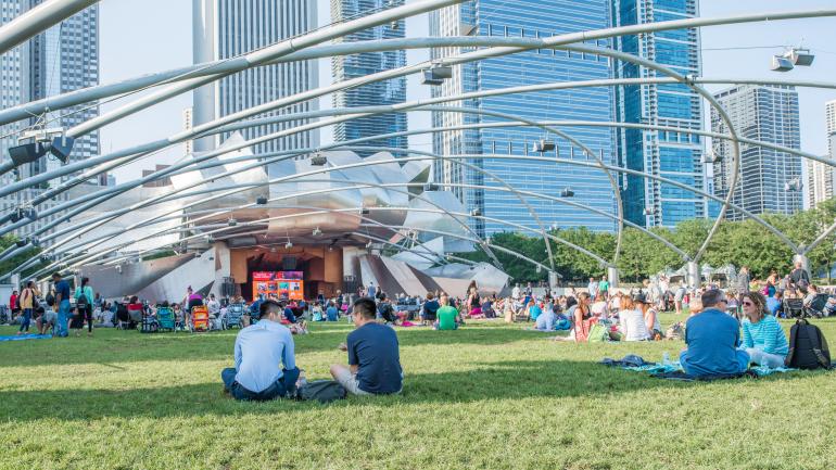 Taking in an outdoor concert at the Jay Pritzker Pavilion in Chicago's Millennium Park Taking in an outdoor concert at the Jay Pritzker Pavilion in Chicago's Millennium Park