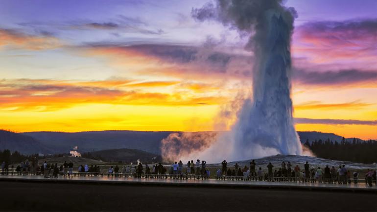 The Old Faithful geyser erupting at Yellowstone National Park in Wyoming The Old Faithful geyser erupting at Yellowstone National Park in Wyoming