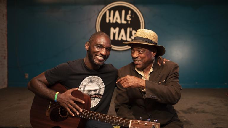 Cedric Burnside and a fellow blues musician at Hal & Mal's Cedric Burnside and a fellow blues musician at Hal & Mal's