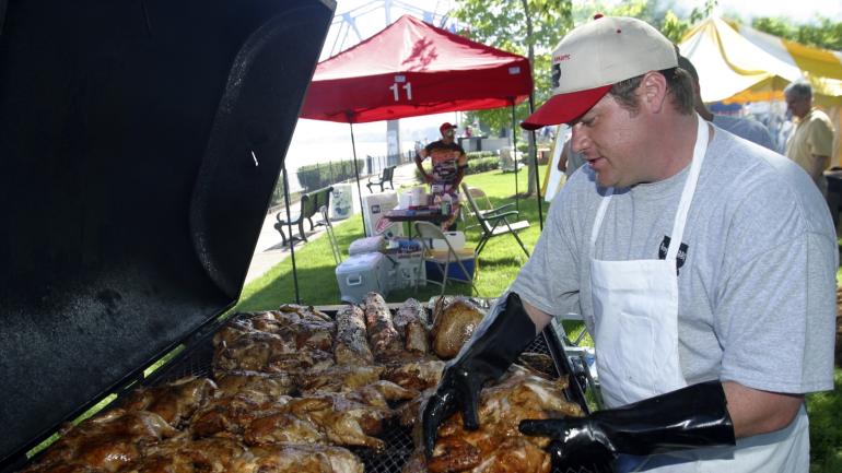 A pitmaster at work during the Kentucky BBQ Festival A pitmaster at work during the Kentucky BBQ Festival
