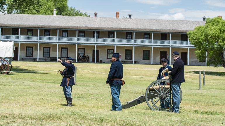 A reenactment of a cannon firing at Fort Laramie National Historic Site in Wyoming A reenactment of a cannon firing at Fort Laramie National Historic Site in Wyoming