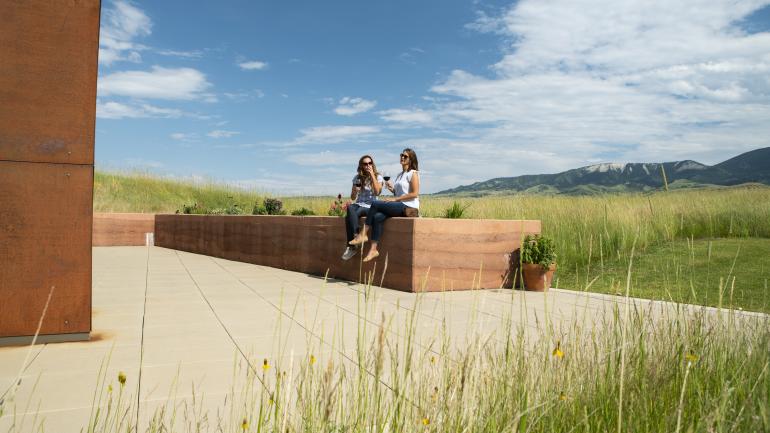 Sipping a glass of wine and enjoying the views outside the Brinton Museum in Sheridan, Wyoming Sipping a glass of wine and enjoying the views outside the Brinton Museum in Sheridan, Wyoming