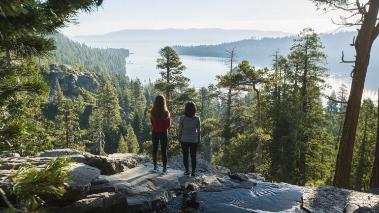 Pausing on a hike of Emerald Bay State Park to gaze at the scenic vistas Pausing on a hike of Emerald Bay State Park to gaze at the scenic vistas