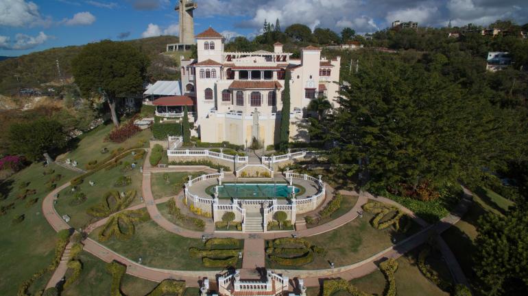 Aerial view of the mansion and its manicured grounds Aerial view of the mansion and its manicured grounds