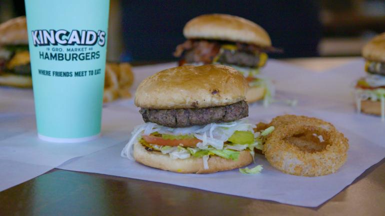A hamburger and onion rings at Kincaid’s in Fort Worth, Texas A hamburger and onion rings at Kincaid’s in Fort Worth, Texas