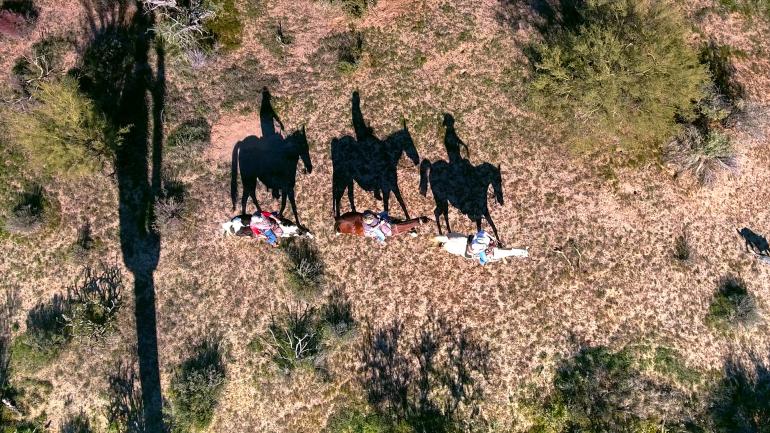 An aerial view of a horseback riding tour in Scottsdale, Arizona An aerial view of a horseback riding tour in Scottsdale, Arizona