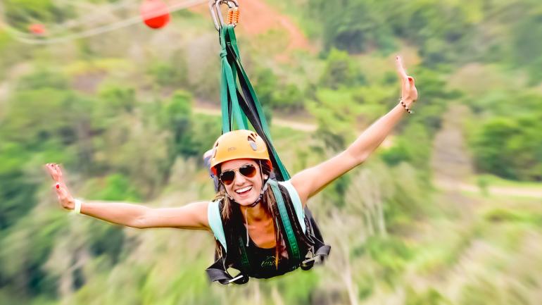 Soaring like a superhero over the treetops on one of the park’s zip lines Soaring like a superhero over the treetops on one of the park’s zip lines