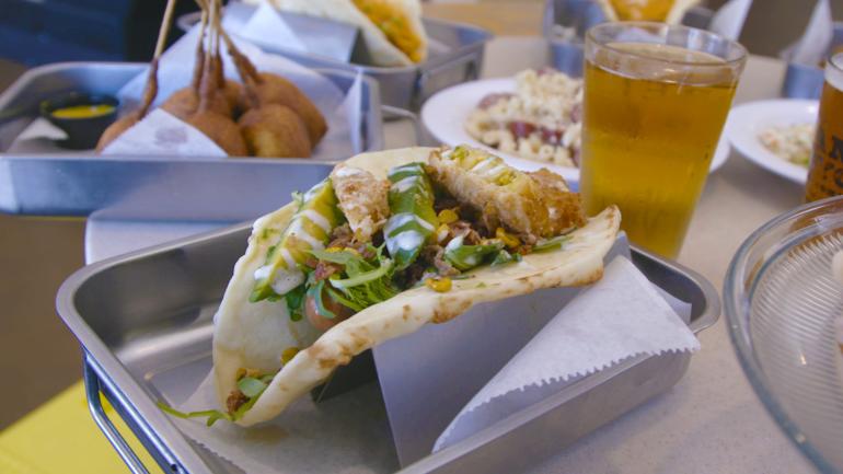 A gourmet hot dog wrapped in naan bread at Short Leash Hotdogs in Phoenix, Arizona A gourmet hot dog wrapped in naan bread at Short Leash Hotdogs in Phoenix, Arizona