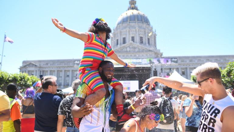friends in front of San Francisco City Hall for Pride Festival friends in front of San Francisco City Hall for Pride Festival