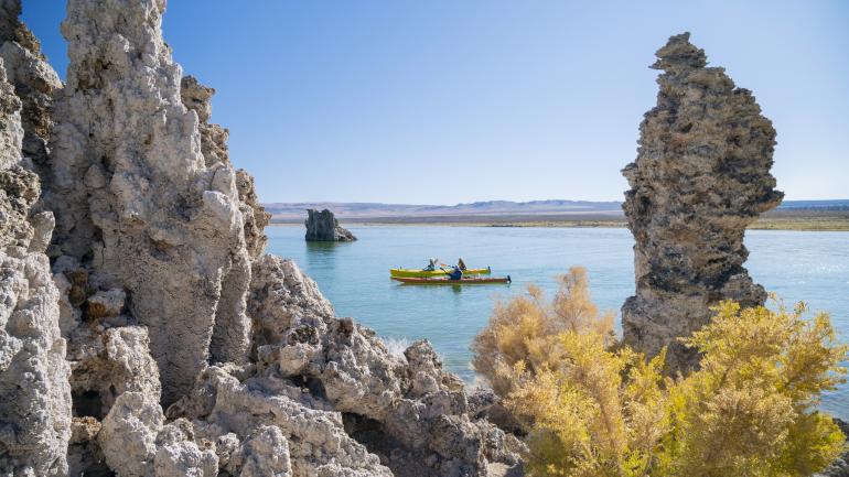Kayaking alongside tufa formations on Mono Lake in California Kayaking alongside tufa formations on Mono Lake in California