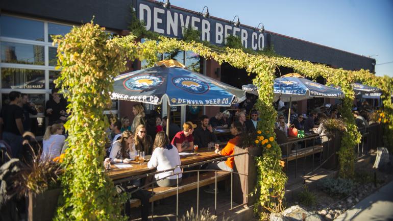 Patrons enjoying a gorgeous day on the patio of the Denver Beer Co. Patrons enjoying a gorgeous day on the patio of the Denver Beer Co.