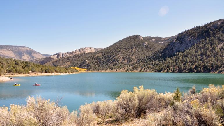 Kayaking surrounded by rolling hills and desert at Cave Lake State Park Kayaking surrounded by rolling hills and desert at Cave Lake State Park
