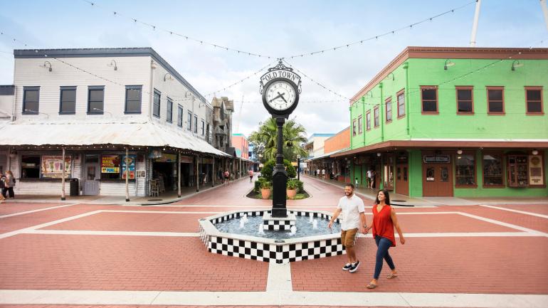 Couple enjoying a walk on the charming streets of Old Town Kissimmee Couple enjoying a walk on the charming streets of Old Town Kissimmee
