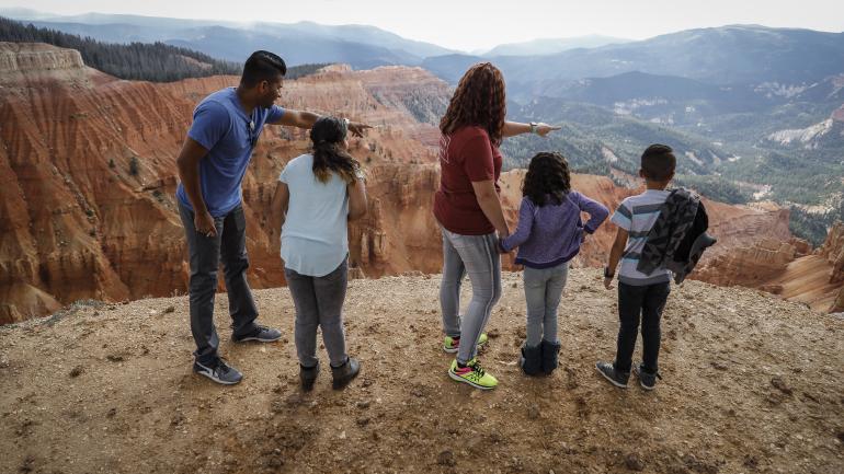 Family admiring the red rock landscape at Cedar Breaks National Monument in Utah Family admiring the red rock landscape at Cedar Breaks National Monument in Utah
