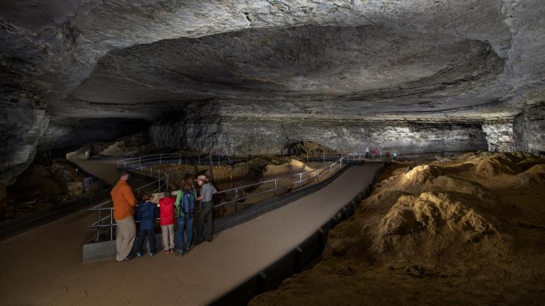 Family touring Mammoth Cave National Park in Kentucky Family touring Mammoth Cave National Park in Kentucky
