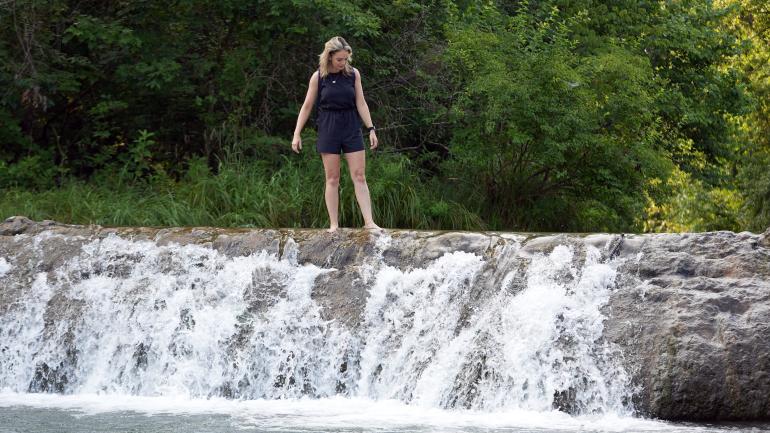 Wading atop Little Niagara, a small waterfall in the Chickasaw National Recreation Area Wading atop Little Niagara, a small waterfall in the Chickasaw National Recreation Area